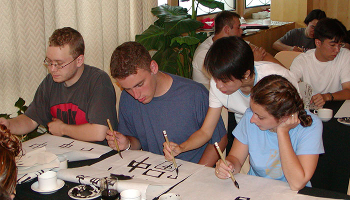 Students learning calligraphy